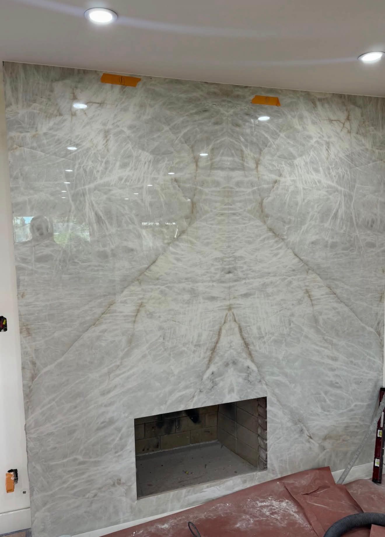 Stunning marble slab fireplace renovation