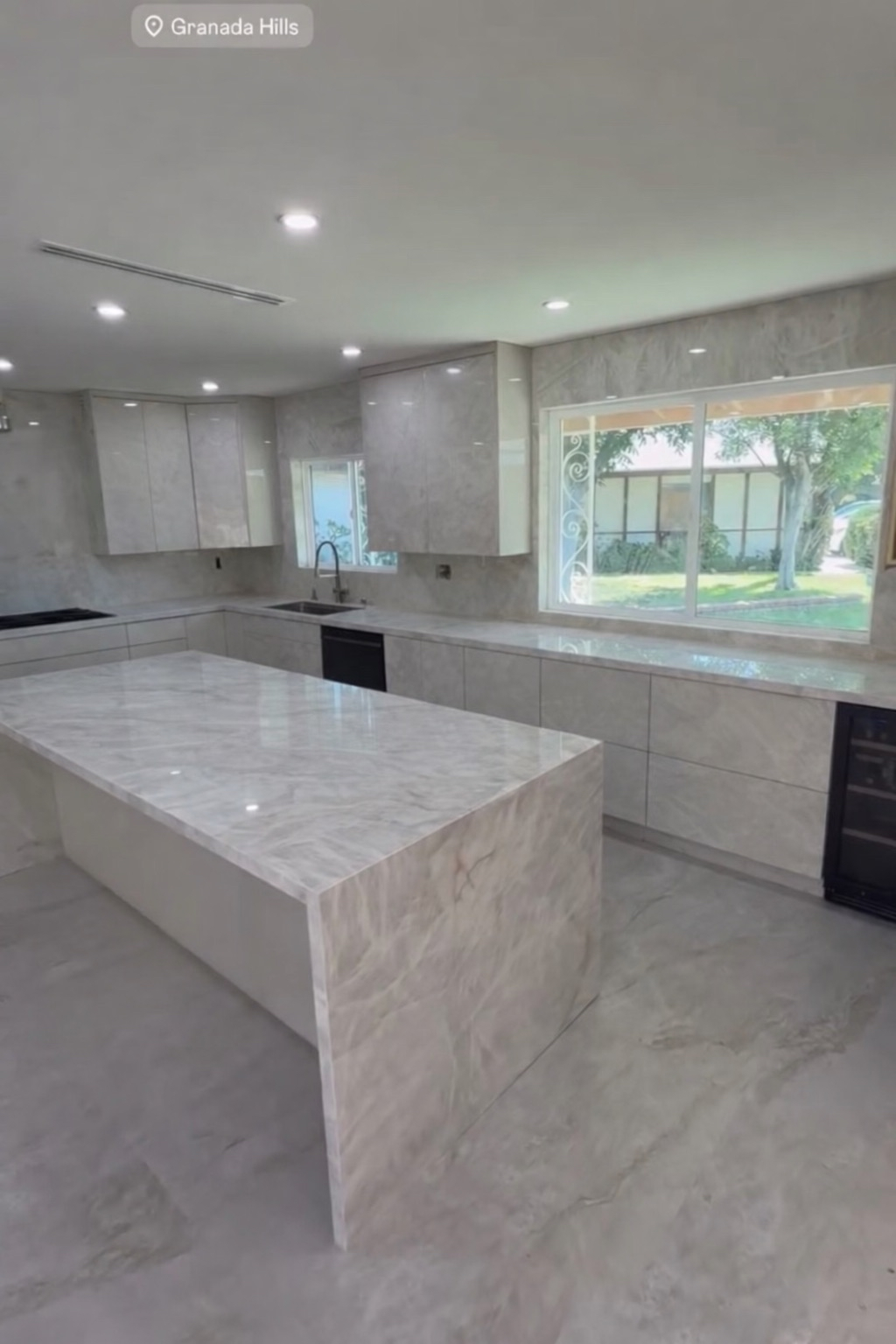 Finished luxury kitchen with marble island in Granada Hills