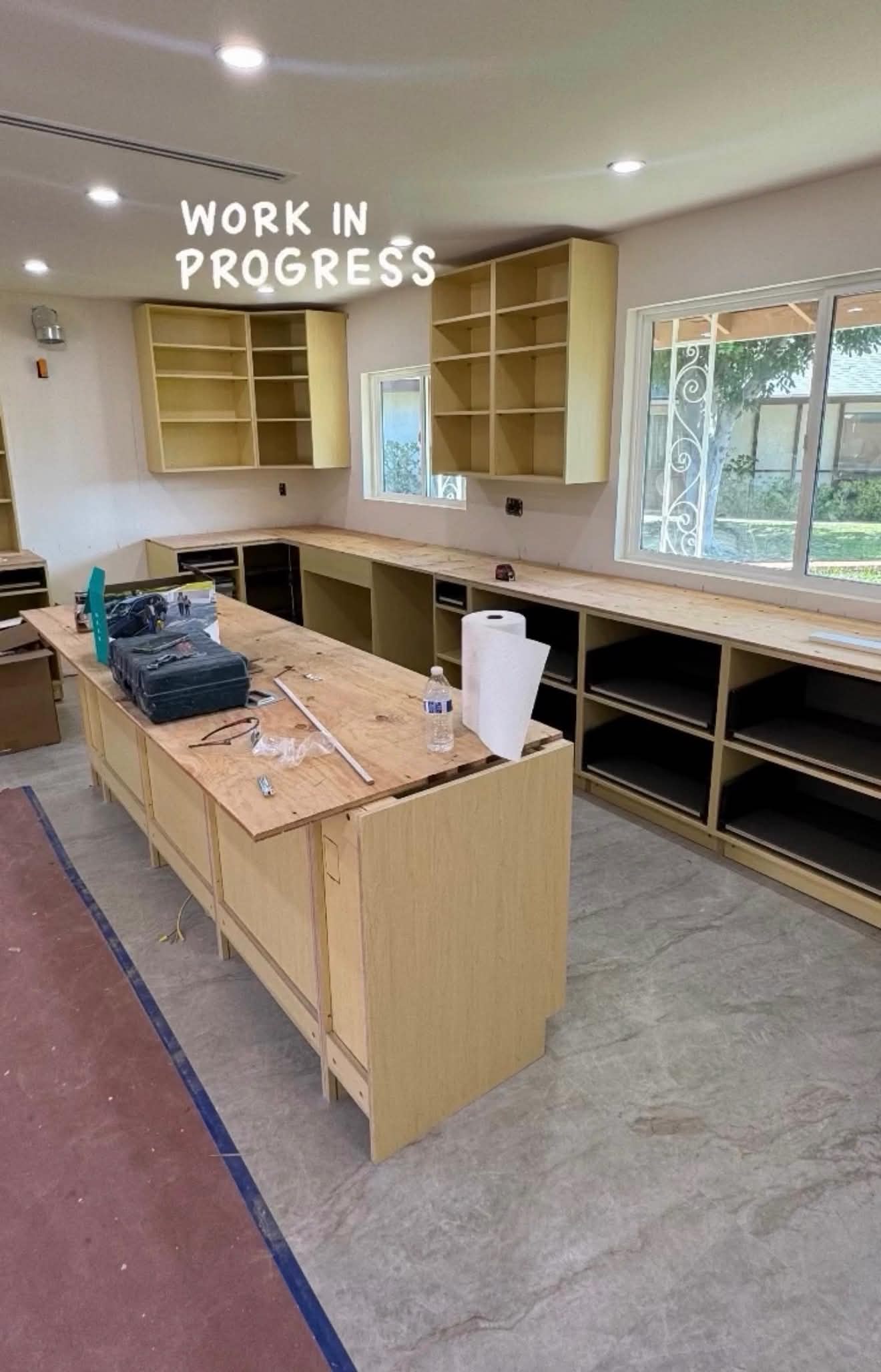 Kitchen work in progress with raw cabinetry